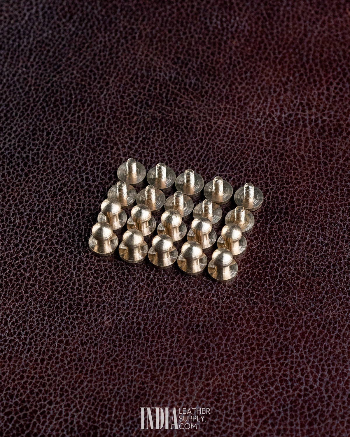 Pack of 10 solid brass button studs with screws, top view | India Leather Supply