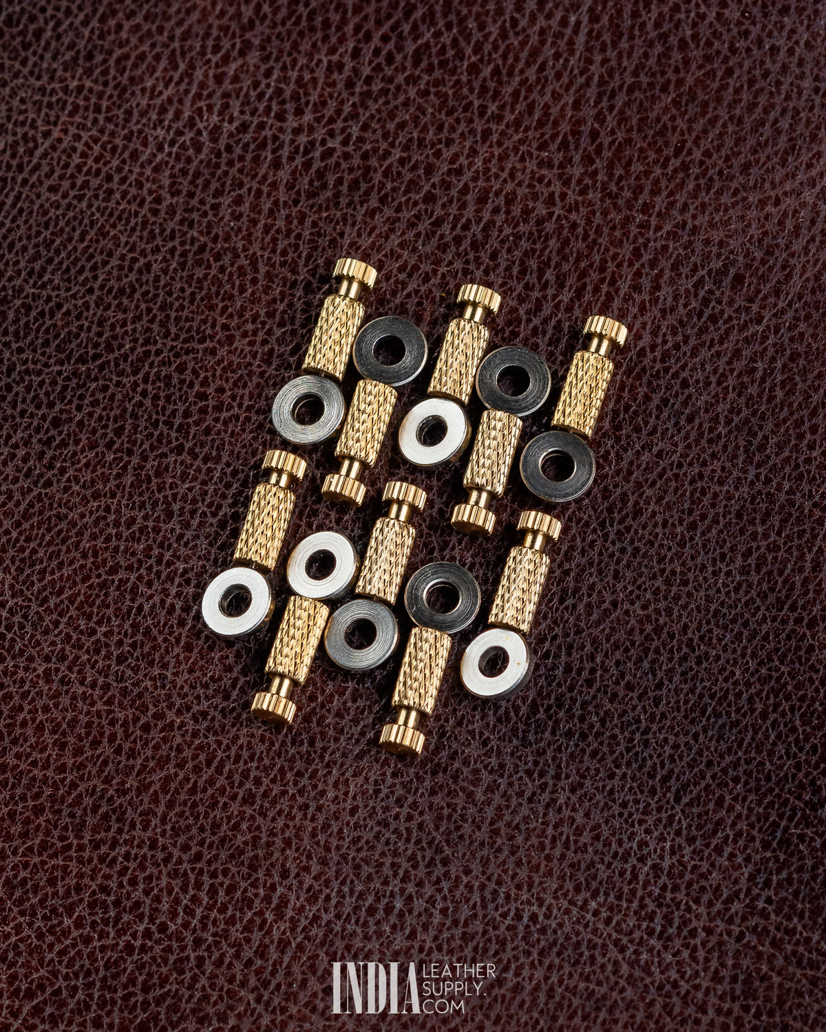 Group of brass positioning needles with washers