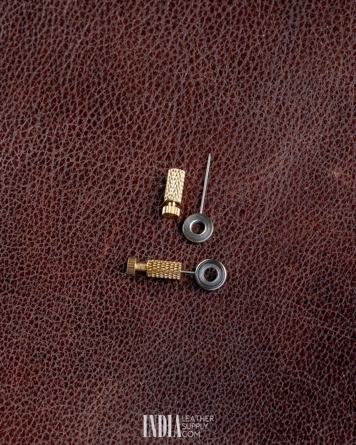 Brass positioning needle taken apart, showing the needle, pipe and washer