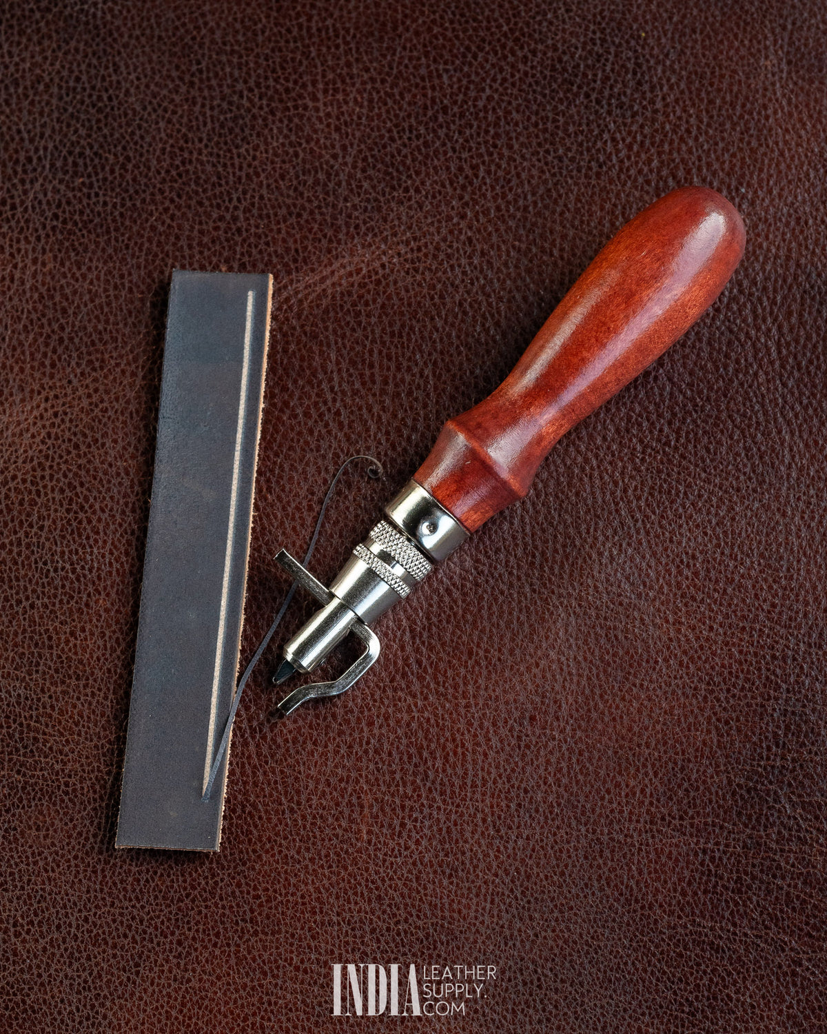 Groover, Creaser & Beveller Multi-Tool | Cutting a stitch groove on dark leather | India Leather Supply